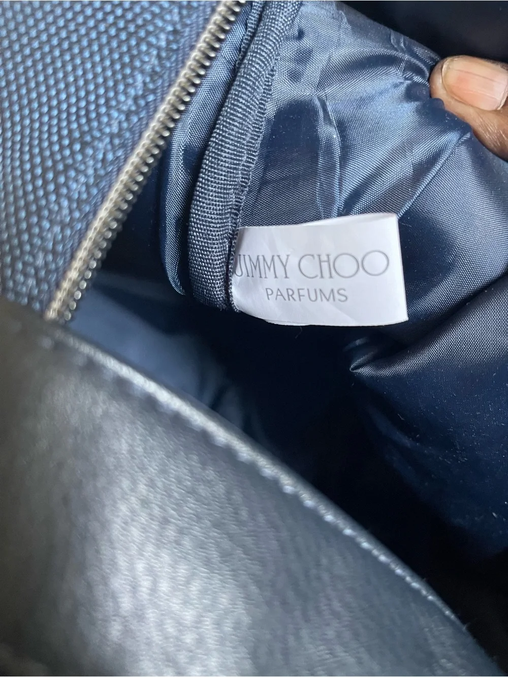 Large navy travel duffel from Jimmy Choo Parfums Durable fabric with leather